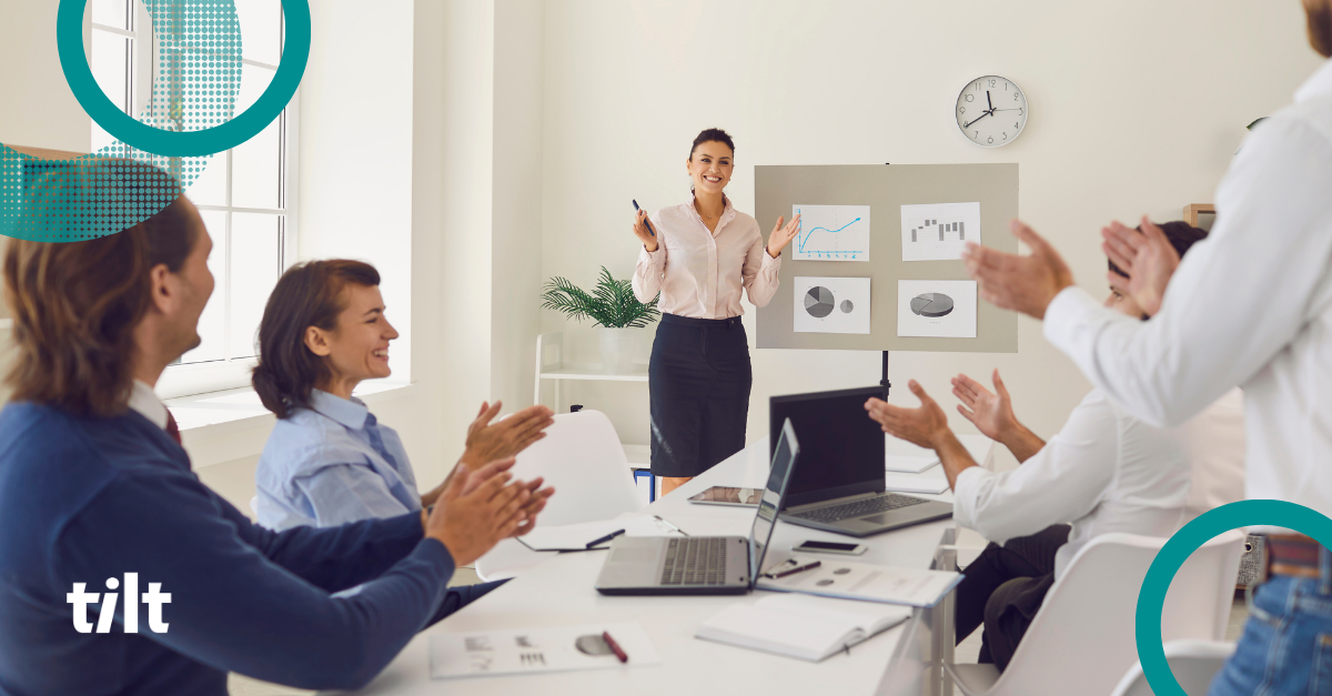 Blog header of workers around an office table