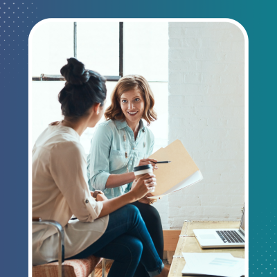 Blog image of two colleagues on a couch having a conversation