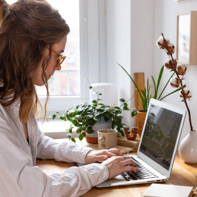 Blog graphic of woman typing on her computer